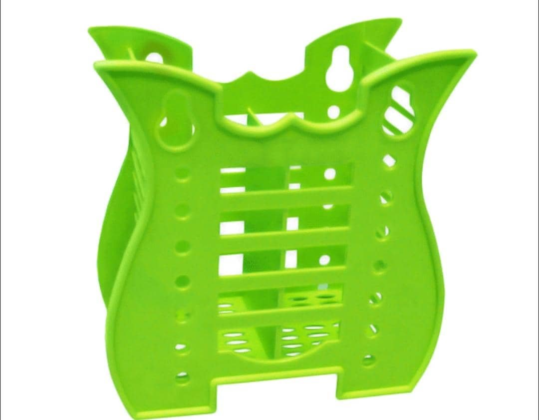 Green plastic tooth brush holder.