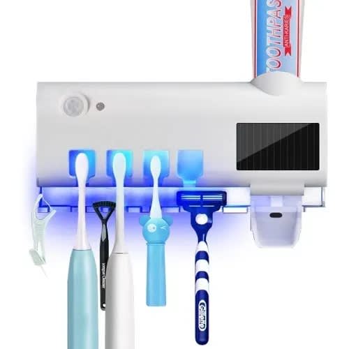 Toothbrush Sterilizer And Toothpaste Dispenser